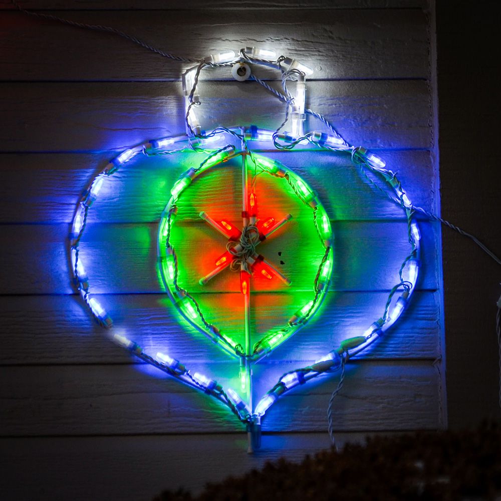 Onion Ornament LED Display mounted on house siding with blue outer ring and green and red center LED lights