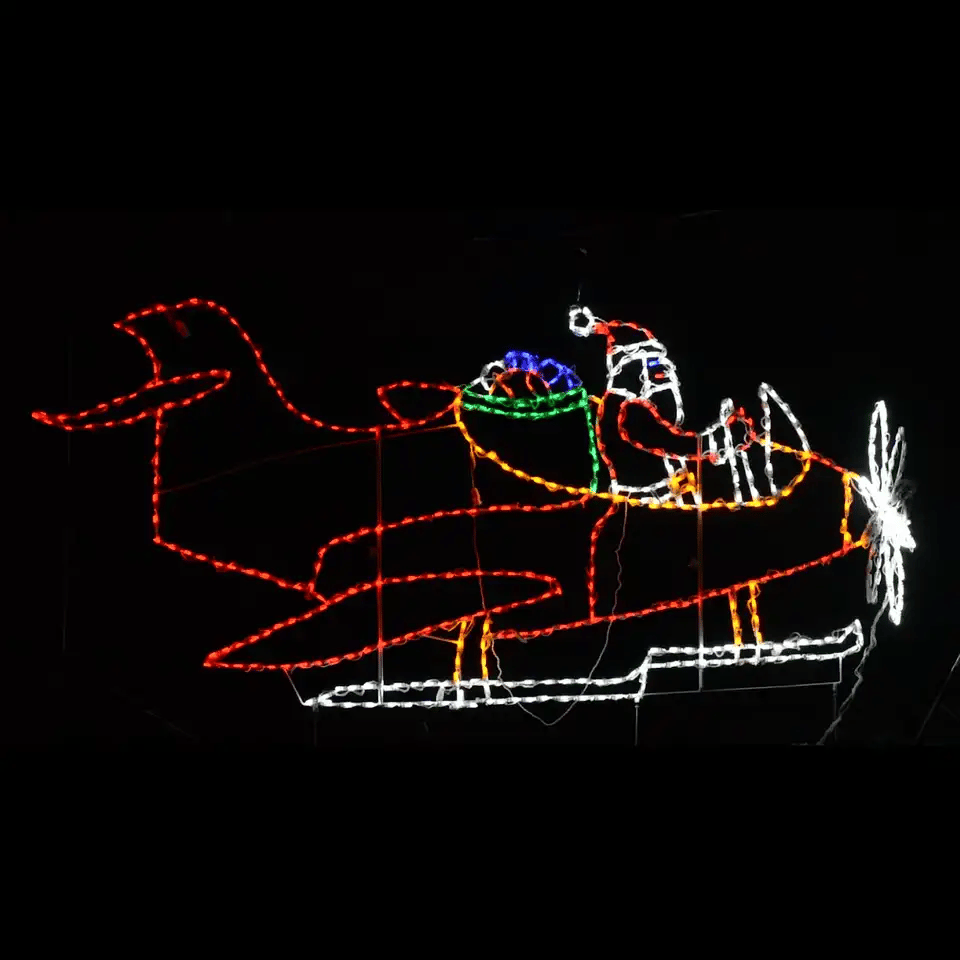 Animated LED Christmas display featuring Santa flying a plane.