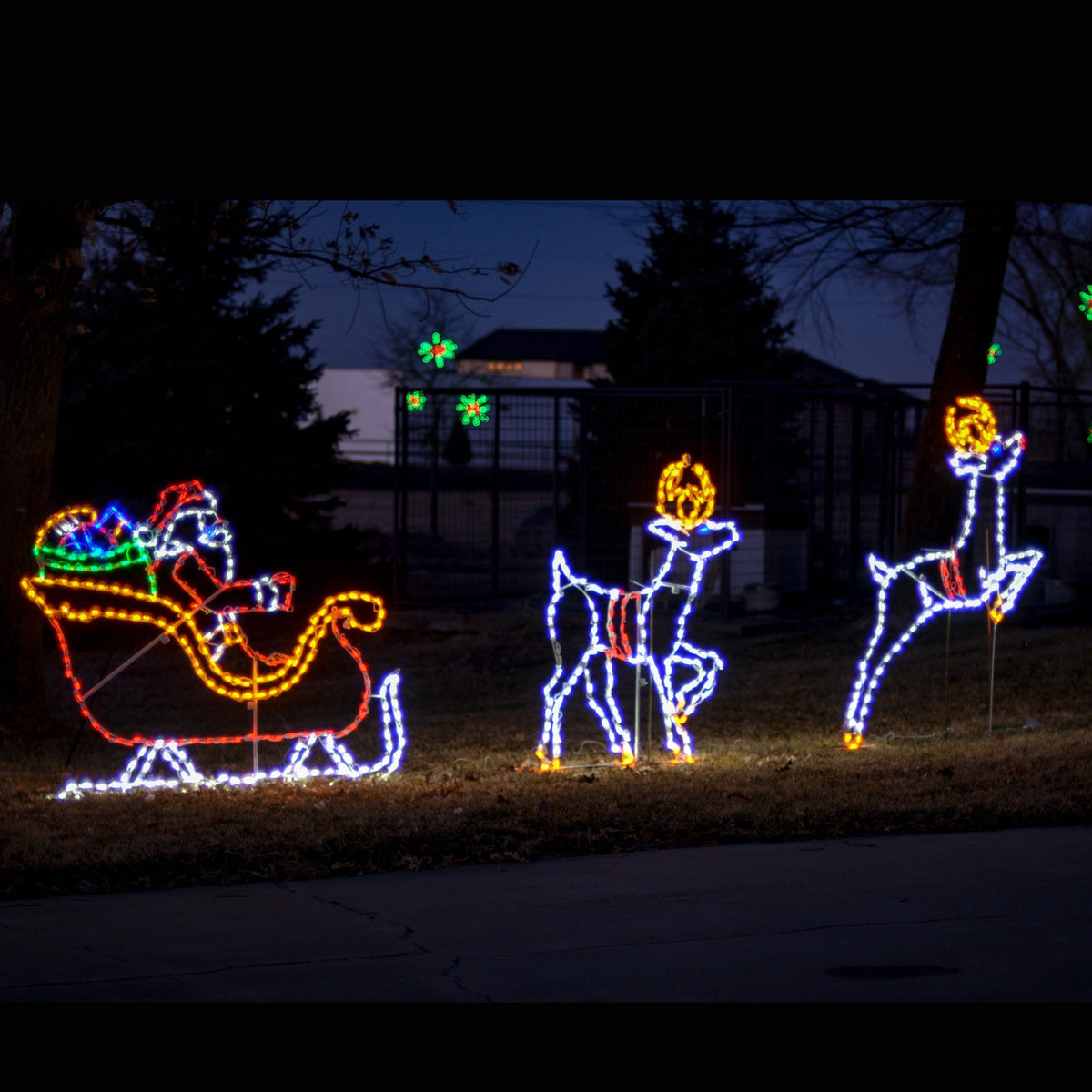 Santa in Sleigh with Reindeer Scene LED Display lit up at night